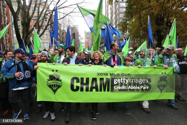 Fans show their support for the Seattle Sounders during their MLS Cup victory parade on November 12, 2019 in Seattle, Washington.