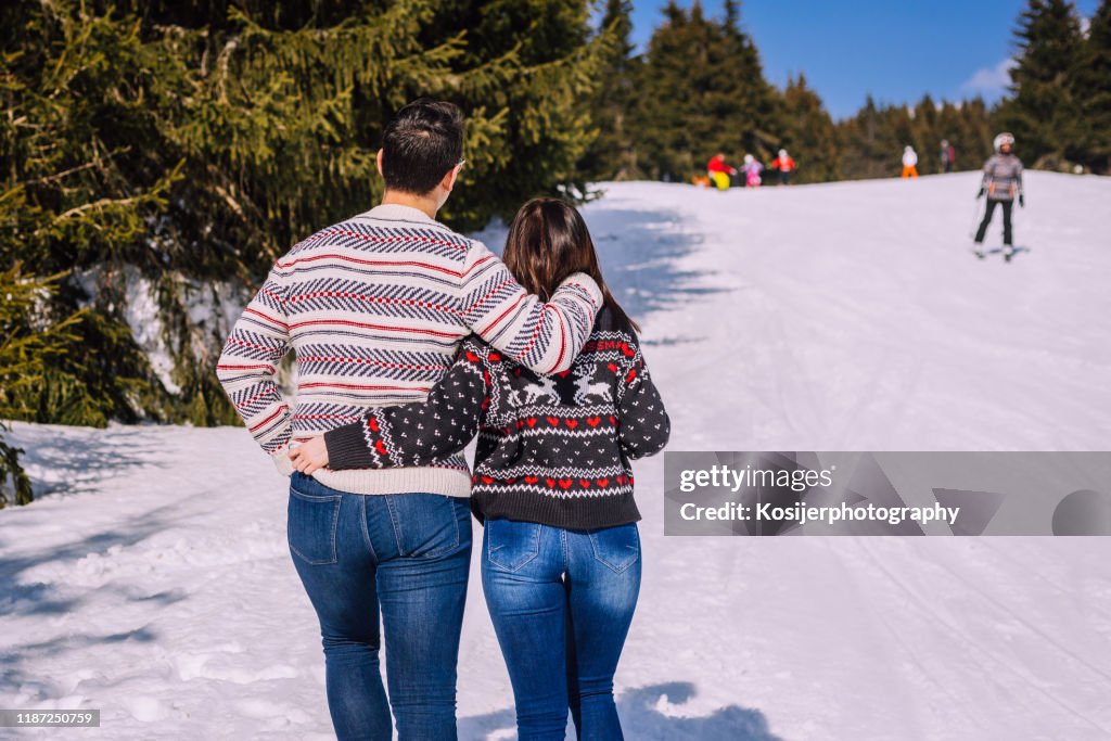 Couple walking on the snow