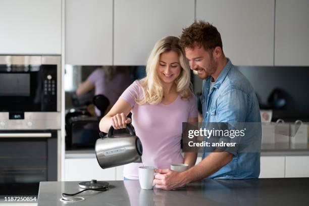 Happy Tea Making Couple Making Tea Photos and Premium High Res Pictures - Getty Images