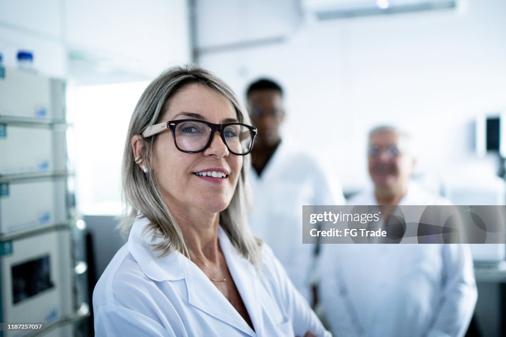 Portrait of smiling scientist looking at camera