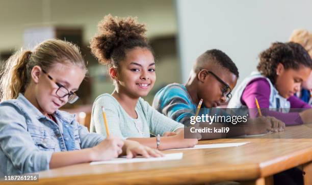 Students Writing Test Kids Writing On Paper Photos and Premium High Res Pictures - Getty Images