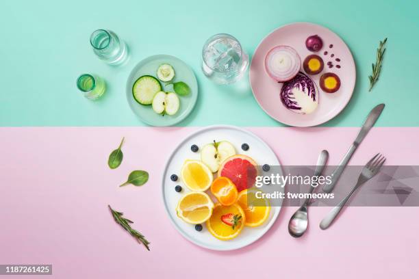 colourful vegan food eating conceptual still life. - detox stock pictures, royalty-free photos & images