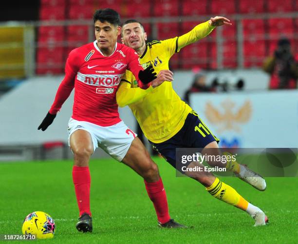Lorenzo Melgarejo of FC Spartak Moscow and Aleksei Ionov of FC Rostov Rostov-on-Don vie for the ball during the Russian Premier League match between...