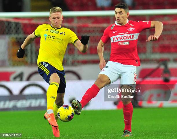 Ezequiel Ponce of FC Spartak Moscow and Dmitri Chistyakov of FC Rostov Rostov-on-Don vie for the ball during the Russian Premier League match between...