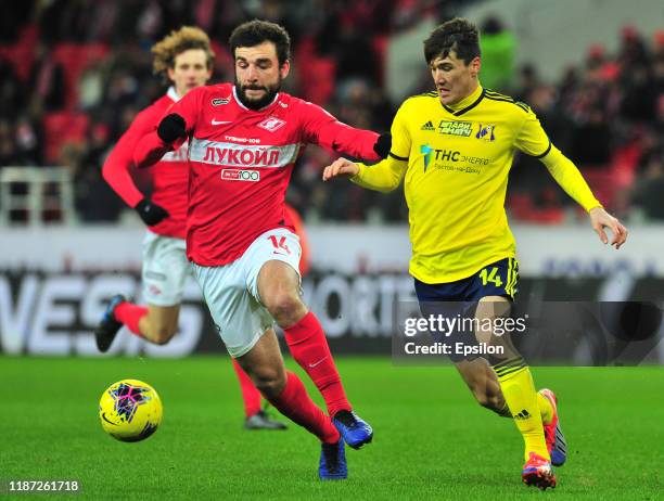 Georgi Dzhikiya of FC Spartak Moscow and Eldor Shomurodov of FC Rostov Rostov-on-Don vie for the ball during the Russian Premier League match between...