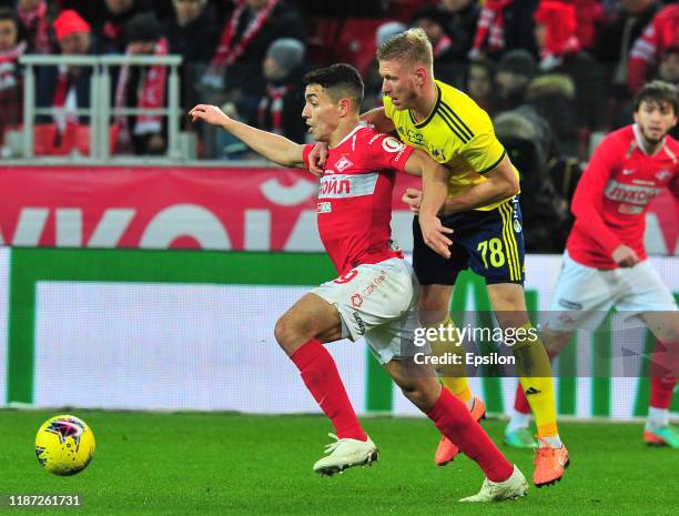 Ezequiel Ponce of FC Spartak Moscow and Dmitri Chistyakov of FC Rostov Rostov-on-Don vie for the ball during the Russian Premier League match between...