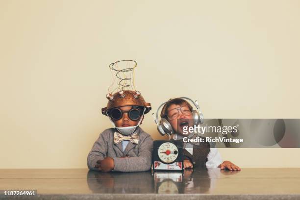 young boys with mind reading invention - child inventor stock pictures, royalty-free photos & images