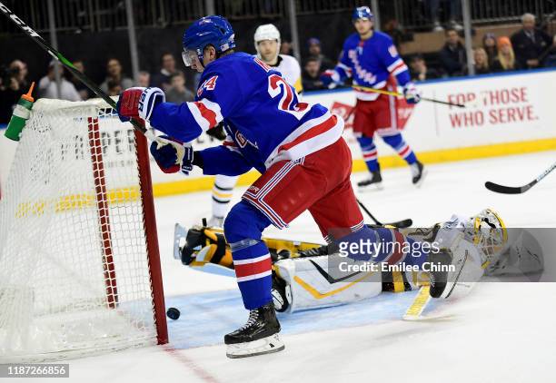 Kaapo Kakko of the New York Rangers scores a goal in overtime for a score of 3-2 during their game against the Pittsburgh Penguins at Madison Square...
