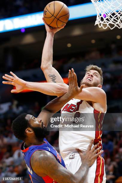 Meyers Leonard of the Miami Heat shoots over Andre Drummond of the Detroit Pistons during the second half at American Airlines Arena on November 12,...