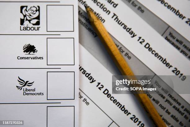 In this photo illustration, a ballot Paper seen displayed showing logos of Labour Party, Conservative Party and Liberal Democrats.