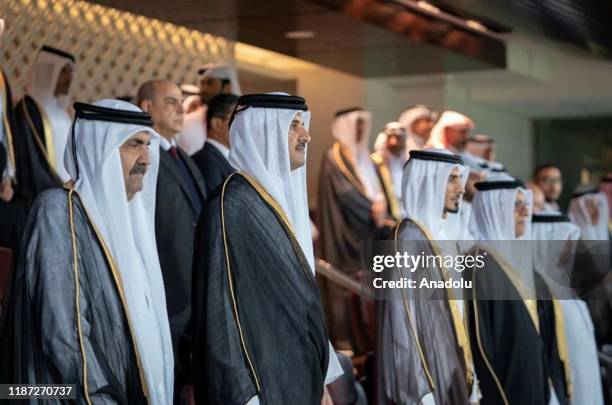 Qatar's Emir Sheikh Tamim bin Hamad al-Thani and his father Hamad bin Khalifa Al Thani attend the 24th Arabian Gulf Cup Final football match between...