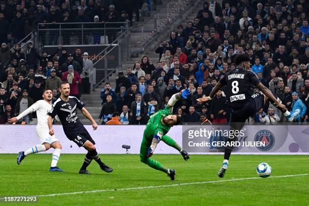 Marseille's Serbian forward Nemanja Radonjic shoots and scores a goal past Bordeaux's French goalkeeper Benoit Costil during the French L1 football...