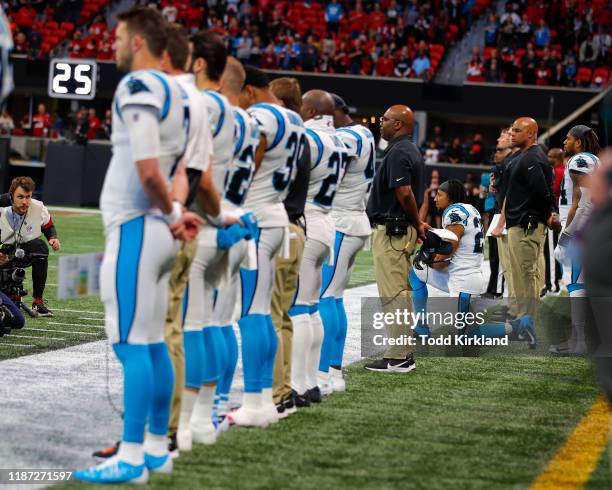 Eric Reid of the Carolina Panthers kneels during the national anthem in the first half on an NFL game against the Atlanta Falcons at Mercedes-Benz...