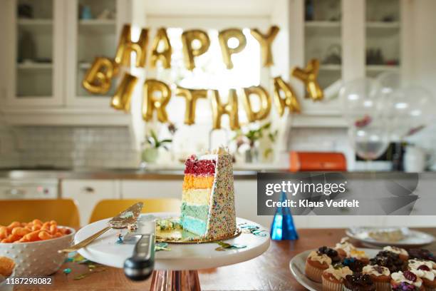 cake slice on table during birthday party - birthday cake stock pictures, royalty-free photos & images