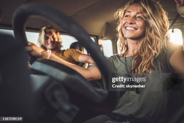 young happy couple enjoying in road trip. - man and woman and car stock pictures, royalty-free photos & images