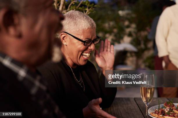 mature woman enjoying party at home - candid stock pictures, royalty-free photos & images
