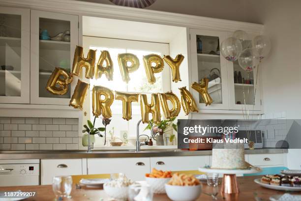 happy birthday text in kitchen at home - draped table stock pictures, royalty-free photos & images