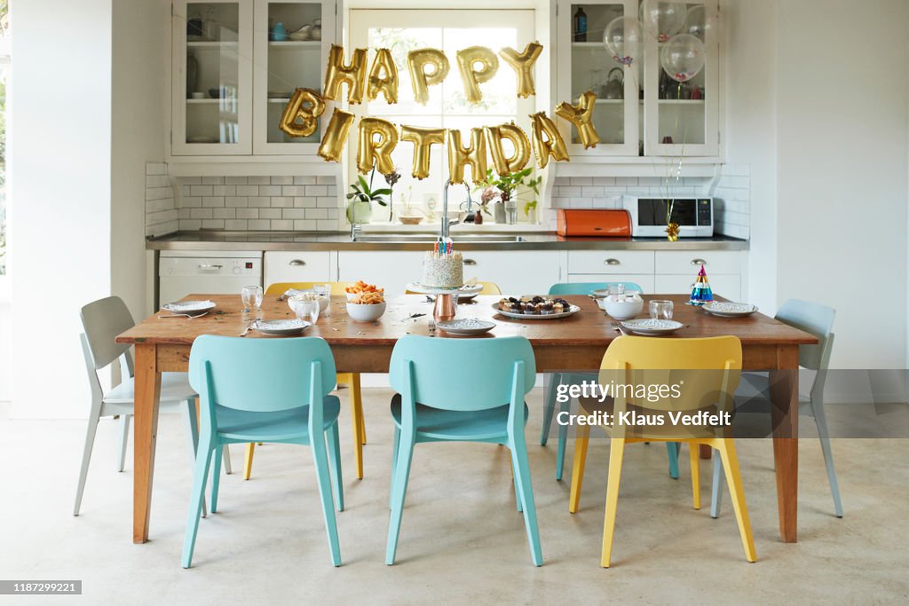 Furniture in kitchen during birthday party