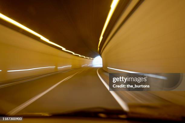 driving through a tunnel, light at the end of tunnel - light at the end of the tunnel - fotografias e filmes do acervo