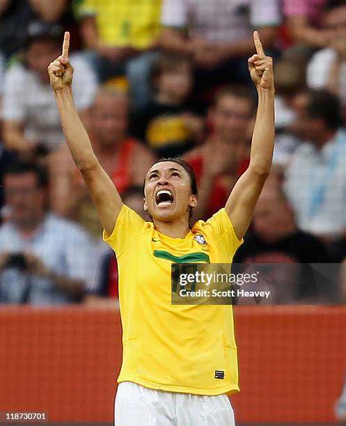 Marta of Brazil celebrates after scoring their second goal during the Women's World Cup Quarter Final match between Brazil and USA at Rudolf-Harbig...