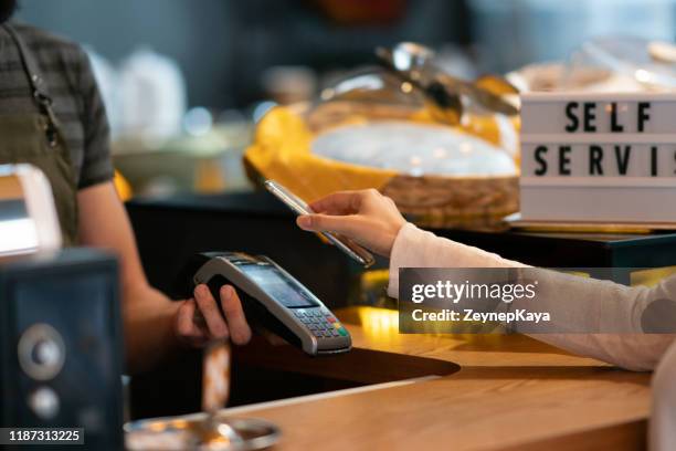 touchless payment - counter intelligence stock pictures, royalty-free photos & images