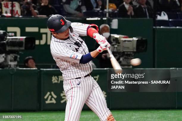 Infielder Hayato Sakamoto of Japan hits a RBI single in the bottom of 2nd inning during the WBSC Premier 12 Super Round game between Japan and Mexico...