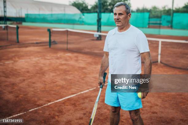 an older man is ready for tennis - fbi director stock pictures, royalty-free photos & images