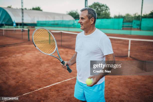 an older man is ready for tennis - fbi director stock pictures, royalty-free photos & images