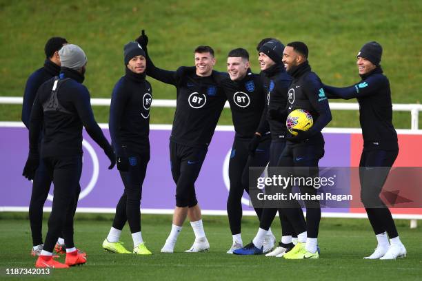 Alex Oxlade-Chamberlain Mason Mount, Declan Rice, Tyrone Mings James Maddison, Callum Wilson, Jadon Sancho and team mates share a joke as they attend...