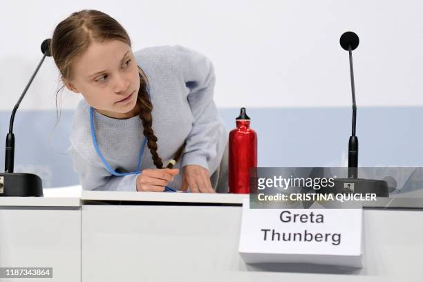 Swedish climate activist Greta Thunberg arrives to hold a press conference with other young activists to discuss the ongoing UN Climate Change...