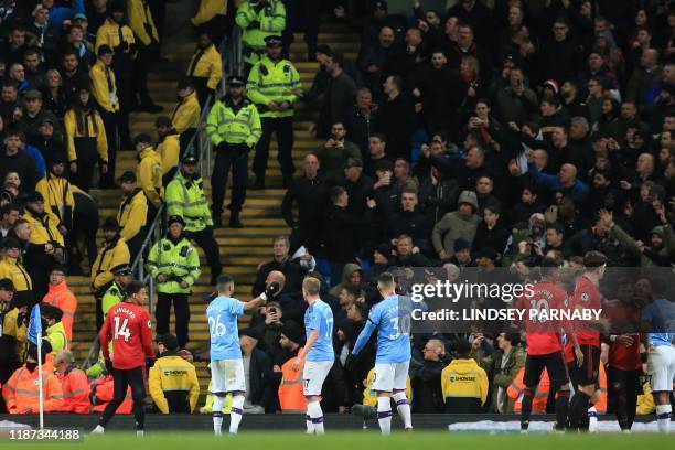 Manchester City's Belgian midfielder Kevin De Bruyne , Manchester City's Argentinian defender Nicolas Otamendi and Manchester City's Algerian...