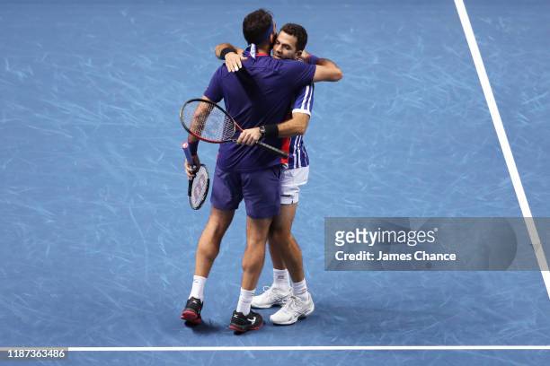 Jean-Julien Rojer of The Netherlands and Horia Tecau of Romania celebrate match point in their doubles match against Juan Sebastian Cabal and Robert...