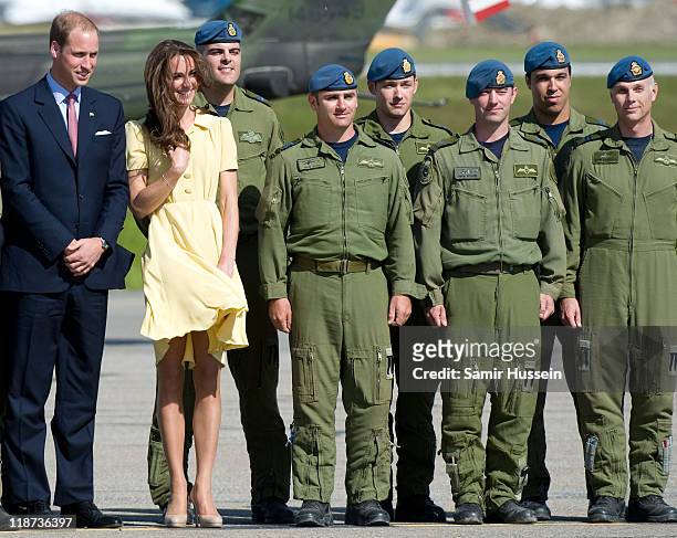 Prince William, Duke of Cambridge and Catherine, Duchess of Cambridge pose with members of the airforce at Calgary Airport on day 8 of the Royal...