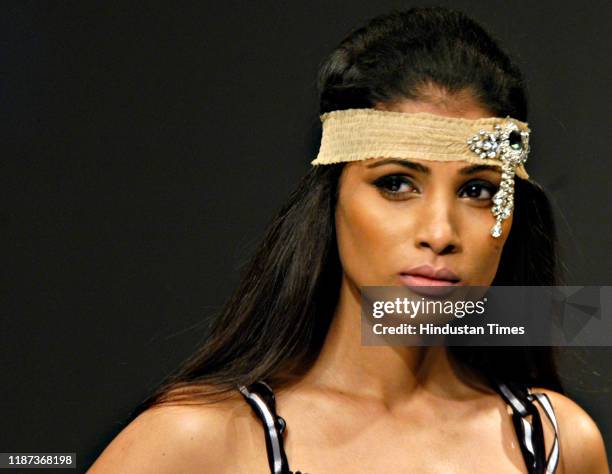 Model displays a creation by fashion designer Surily Goel during the Wills Lifestyle India Fashion Week at Pragati Maidan, on September 7, 2007 in...