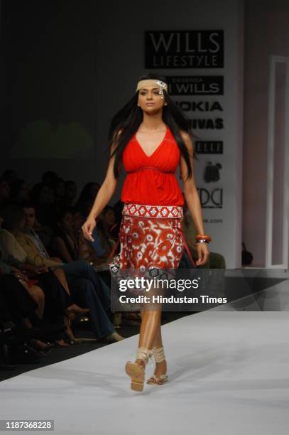 Model displays a creation by fashion designer Surily Goel during the Wills Lifestyle India Fashion Week at Pragati Maidan, on September 7, 2007 in...