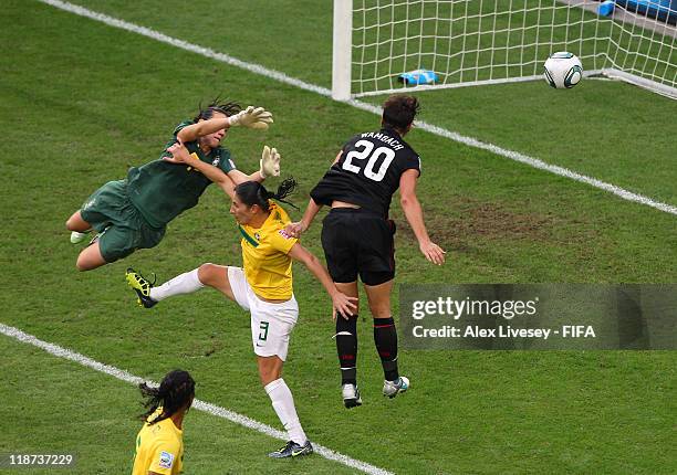 Abby Wambach of USA scores her goal during the FIFA Women's World Cup Quarter Final match between Brazil and USA at Rudolf-Harbig Stadium on July 10,...