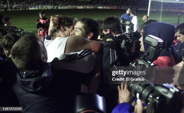Martin Palermo and Juan Roman Riquelme of Boca Juniors celebrate after winning the European-South American Cup club soccer championship against Real...
