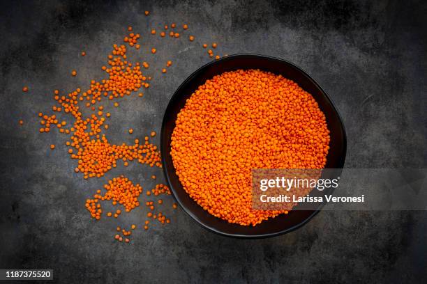 bowl of organic red lentils - red lentil stock pictures, royalty-free photos & images