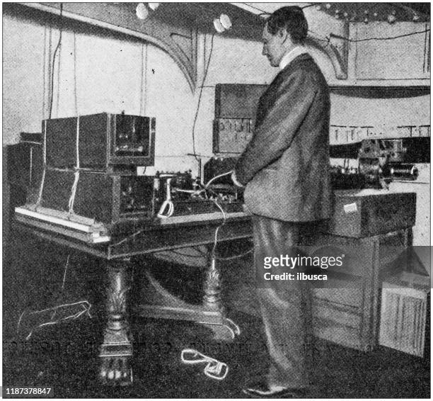 antique photo: marconi and his telegraph radio - guglielmo marconi stock illustrations
