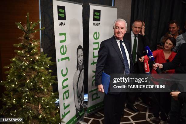 World Anti-Doping Agency President Craig Reedie is surrounded by journalists during a press conference on December 9, 2019 in Lausanne following a...