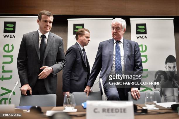 World Anti-Doping Agency President-Elect Witold Banka, WADA Director General Olivier Niggli and WADA President Craig Reedie arrive for a press...