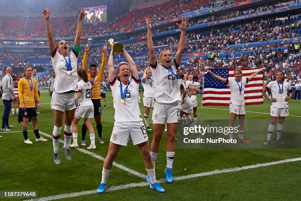 Megan Rapinoe and Alex Morgan of United States celebrate whit her teammates after winning the 2019 FIFA Women's World Cup France Final match between...