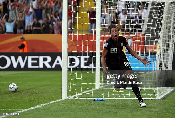 Abby Wambach of USA celebrates after scoring her team's equalizing goal during the FIFA Women's World Cup 2011 Quarter Final match between Brazil and...