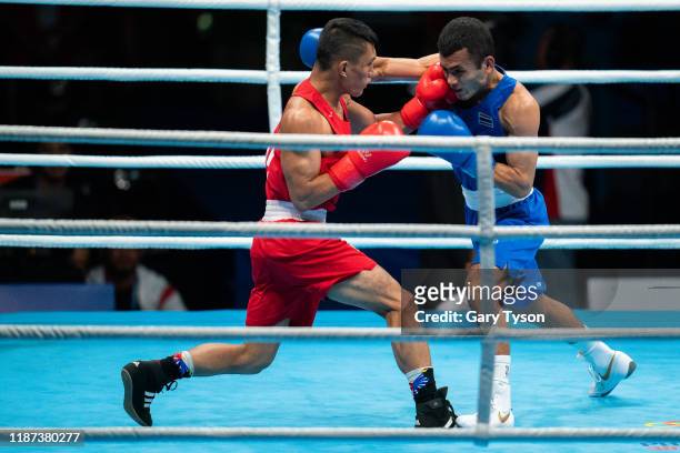 Laden Rogen of the Philippines wins the gold medal against Yaodam Ammarit of Thailand in the Mens Flyweight Boxing Final at PICC Forum on Day 9 at...
