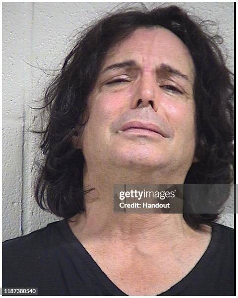 In this handout provided by the Dallas Fort Worth International Airport, actor Richard Grieco poses for a mugshot after being arrested at...