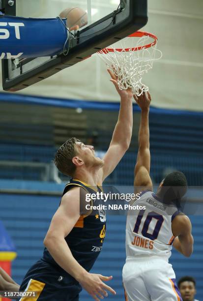 Isaac Hau of the Salt Lake City Stars shoots over Northern Arizona Suns Shawndre Jones during an NBA G-League game at the Lifetime Activities...