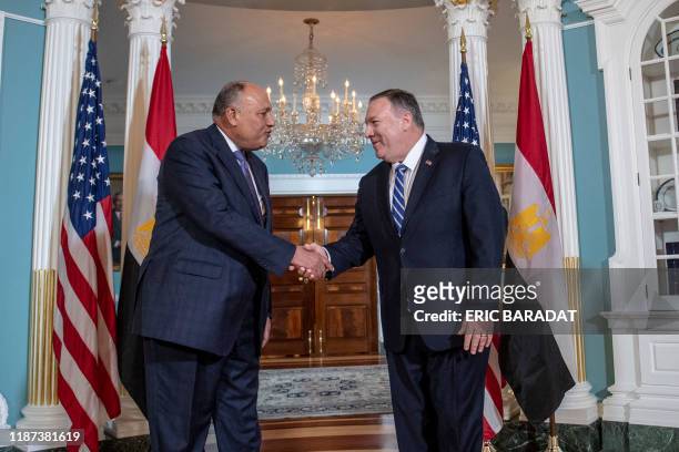 Secretary of State Mike Pompeo shakes hands with Egyptian Foreign Minister Sameh Shoukry, at the Department of State on December 9, 2019 in...