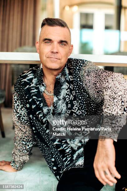Singer Robbie Williams is photographed for Paris Match on October 17, 2019 in London, United Kingdom.