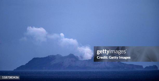 Smoke and ash rises from a volcano on White Island early in the morning on December 10, 2019 in Whakatane, New Zealand. Five people are confirmed...