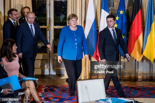 French President Emmanuel Macron, Russian President Vladimir Putin, German Chancellor Angela Merkel and Ukrainian President Volodymyr Zelensky attend...